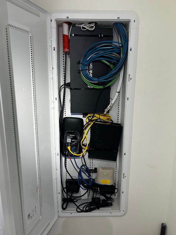 Network closet with managed switch and organized cable management